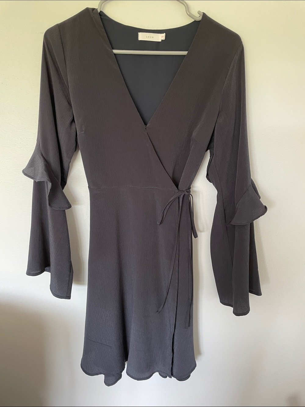 Lush Black Wrap Dress with Ruffled Bell Sleeves